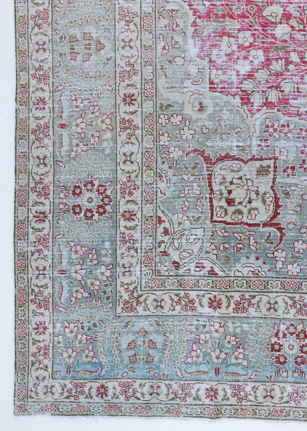 This is a handmade vintage Tabriz rug woven in Persia. The Tabriz region is known for producing some of the most ornate Persian carpet, often known for their mesmerising and intricate repeating patterns.