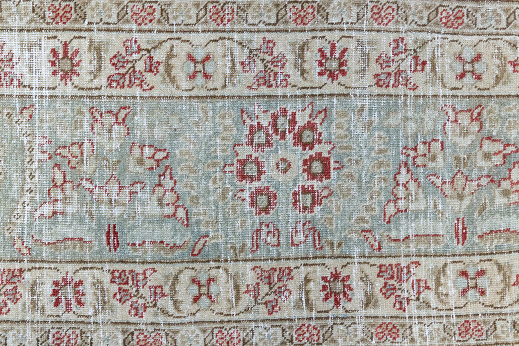 This is a handmade vintage Tabriz rug woven in Persia. The Tabriz region is known for producing some of the most ornate Persian carpet, often known for their mesmerising and intricate repeating patterns.