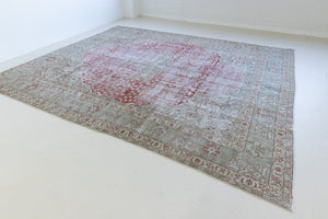 This is a handmade vintage Tabriz rug woven in Persia. The Tabriz region is known for producing some of the most ornate Persian carpet, often known for their mesmerising and intricate repeating patterns.