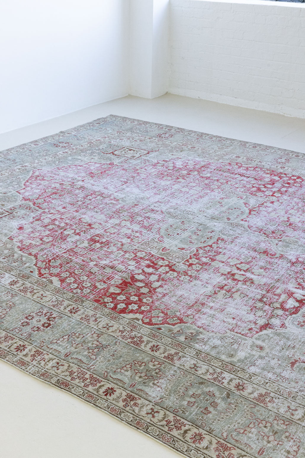 This is a handmade vintage Tabriz rug woven in Persia. The Tabriz region is known for producing some of the most ornate Persian carpet, often known for their mesmerising and intricate repeating patterns.