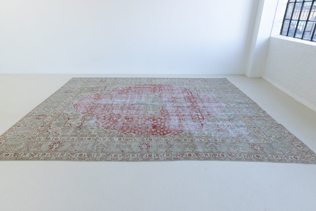 This is a handmade vintage Tabriz rug woven in Persia. The Tabriz region is known for producing some of the most ornate Persian carpet, often known for their mesmerising and intricate repeating patterns.