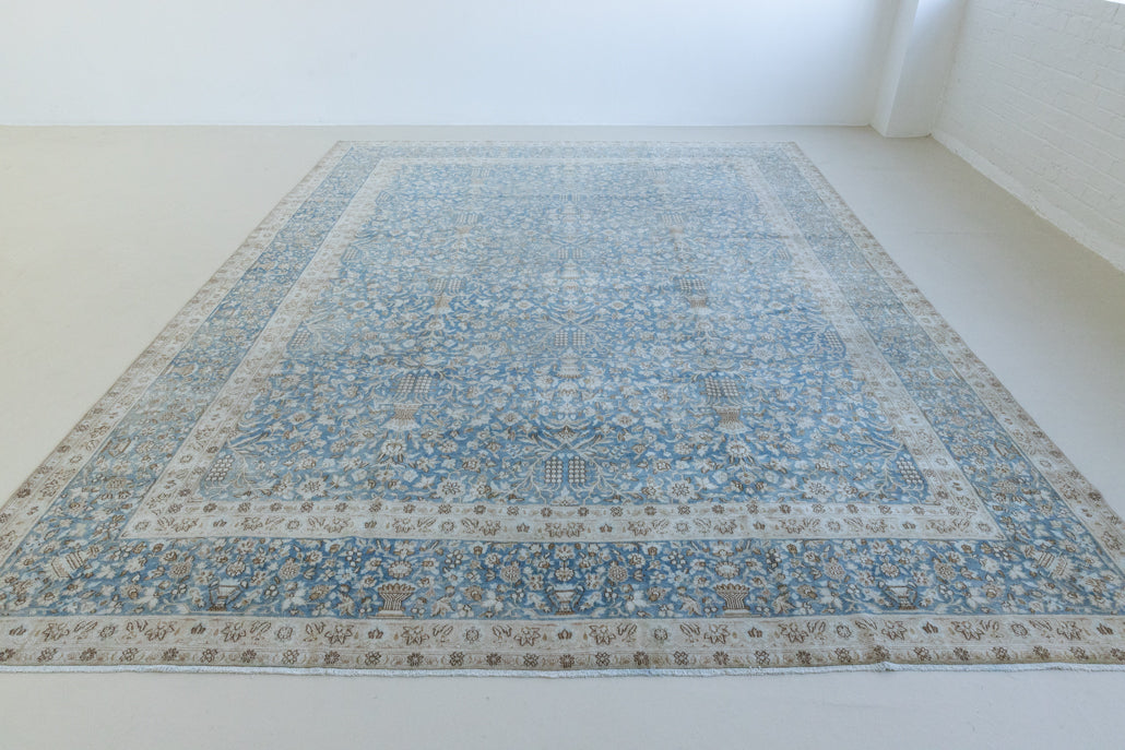 Tess is an original oversized Persian Kerman rugs from the the south east of Kerman, carpets from this part of Persia often feature very intricate floral designs. This is a lovely rug with muted tones.
