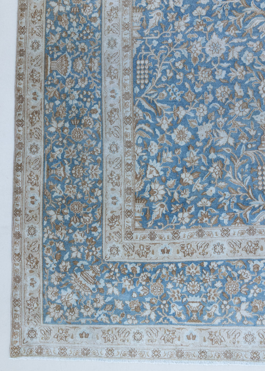 Tess is an original oversized Persian Kerman rugs from the the south east of Kerman, carpets from this part of Persia often feature very intricate floral designs. This is a lovely rug with muted tones.