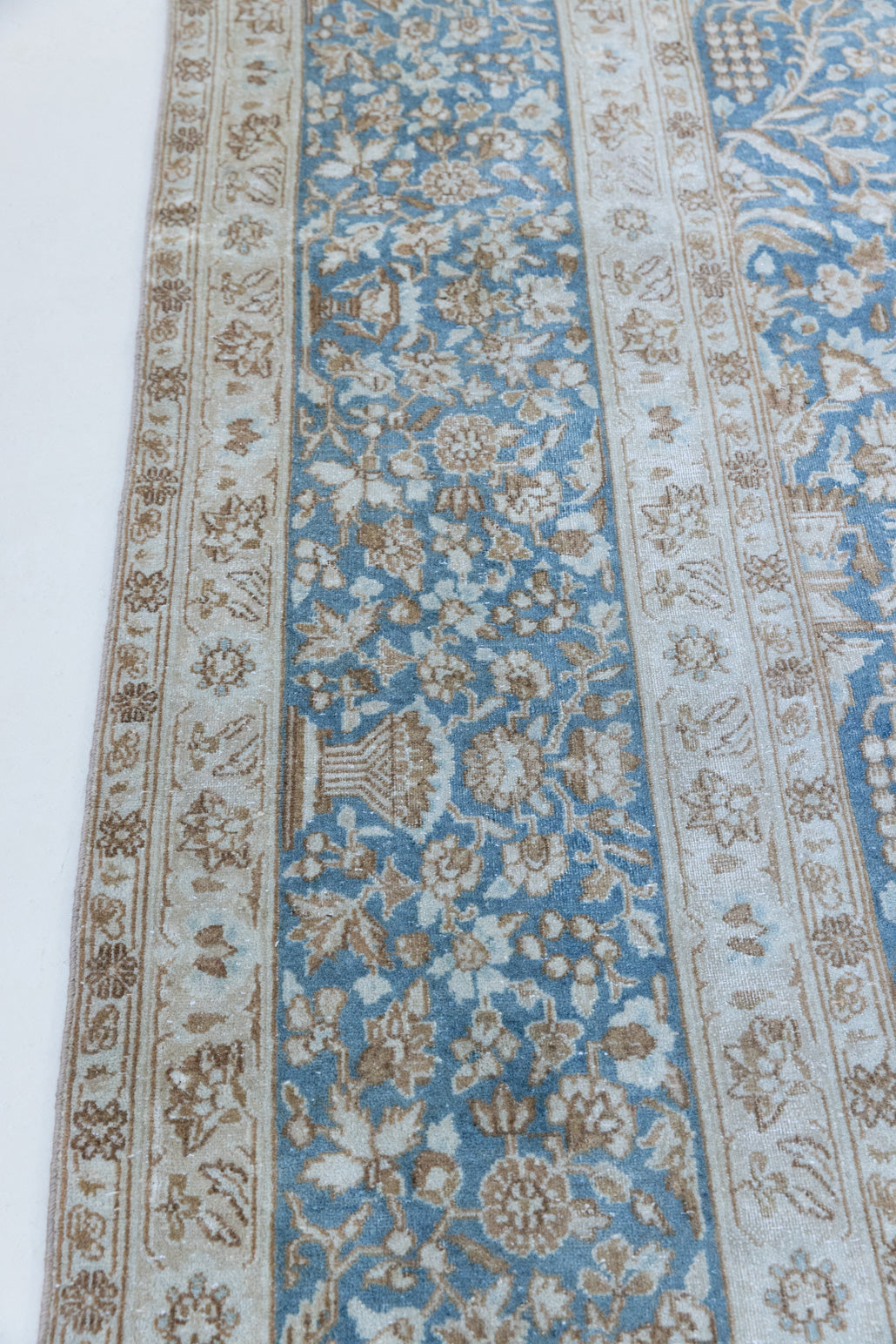 Tess is an original oversized Persian Kerman rugs from the the south east of Kerman, carpets from this part of Persia often feature very intricate floral designs. This is a lovely rug with muted tones.