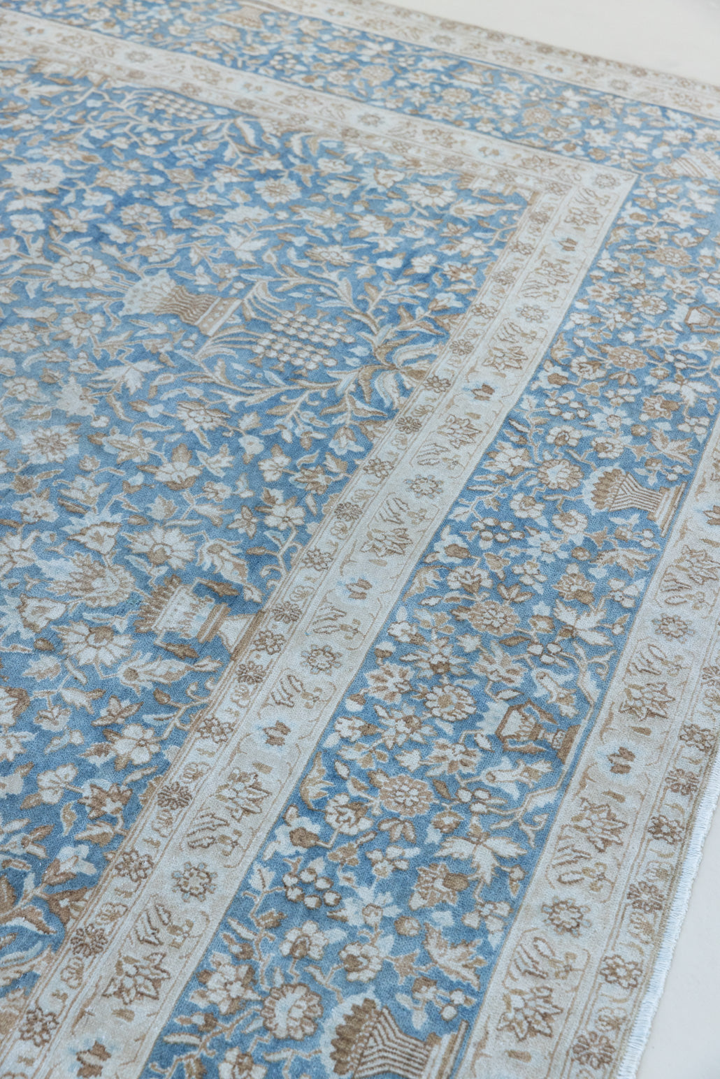 Tess is an original oversized Persian Kerman rugs from the the south east of Kerman, carpets from this part of Persia often feature very intricate floral designs. This is a lovely rug with muted tones.