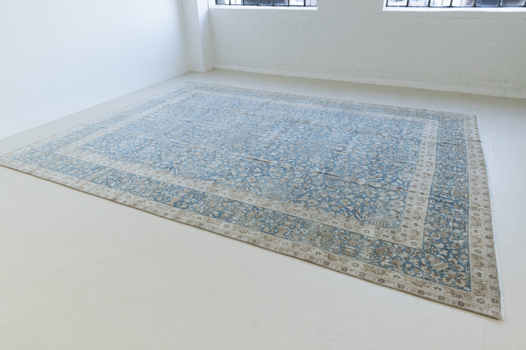 Tess is an original oversized Persian Kerman rugs from the the south east of Kerman, carpets from this part of Persia often feature very intricate floral designs. This is a lovely rug with muted tones.