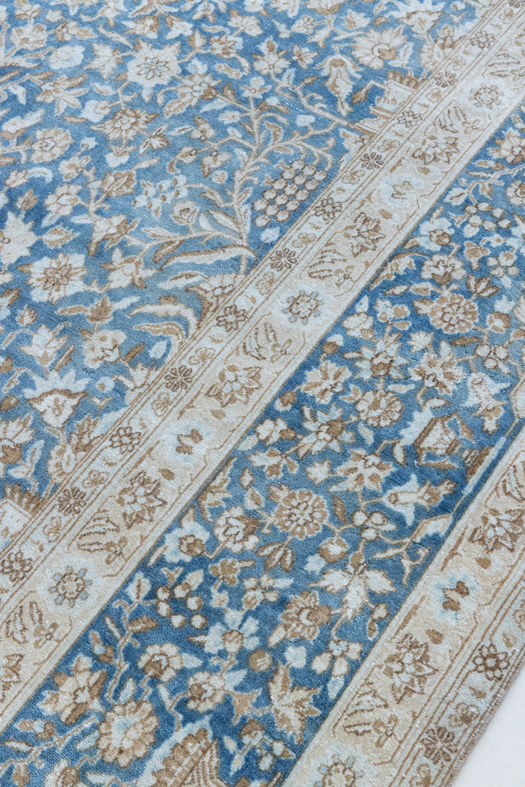 Tess is an original oversized Persian Kerman rugs from the the south east of Kerman, carpets from this part of Persia often feature very intricate floral designs. This is a lovely rug with muted tones.