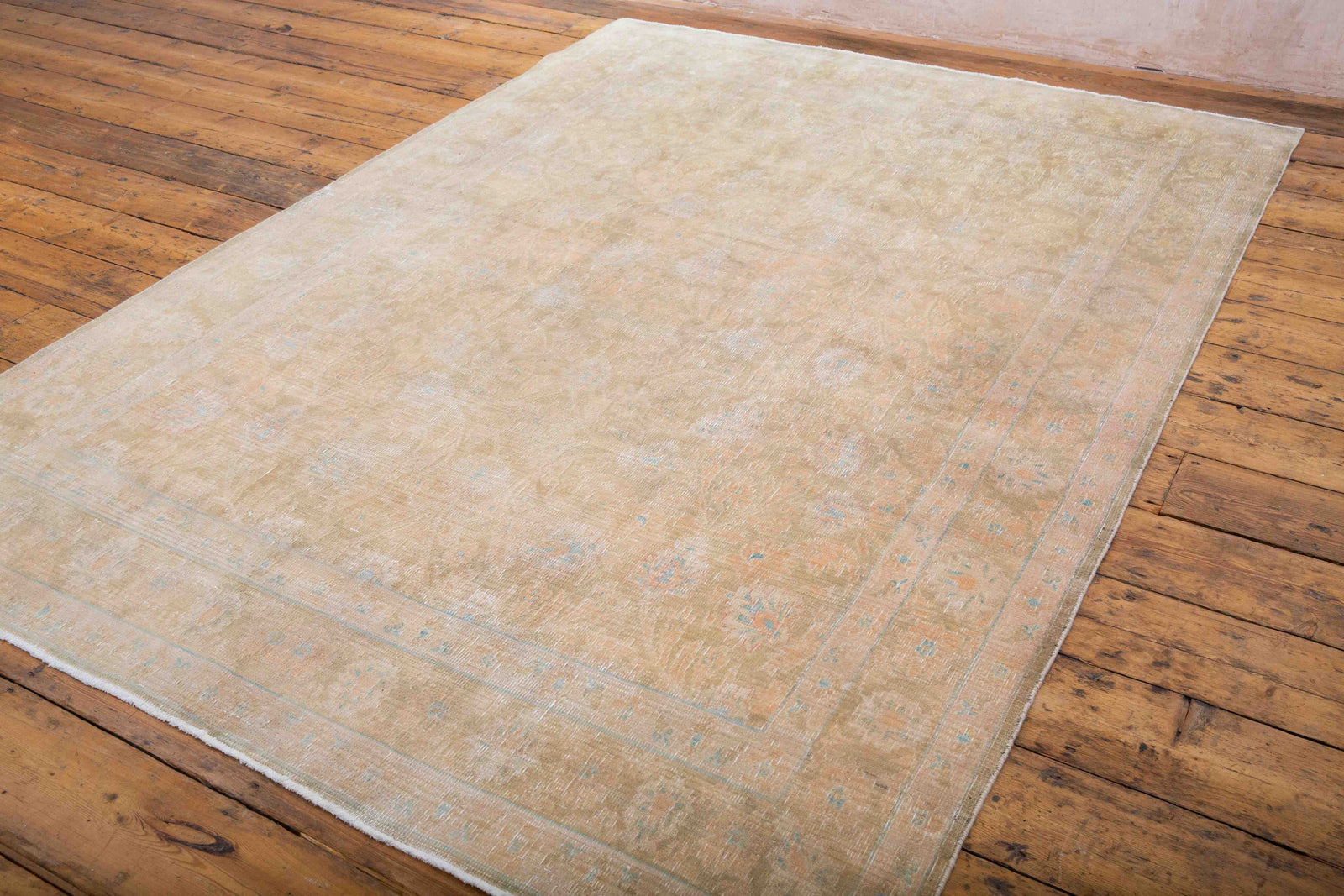 This is a vintage Persian Tabriz rug that has been over-dyed to gently fade its original colours, giving a more neutral palette. Persia has the most desirable rugs and carpets with stunning designs such as this carpet. Now available at Ourika London.