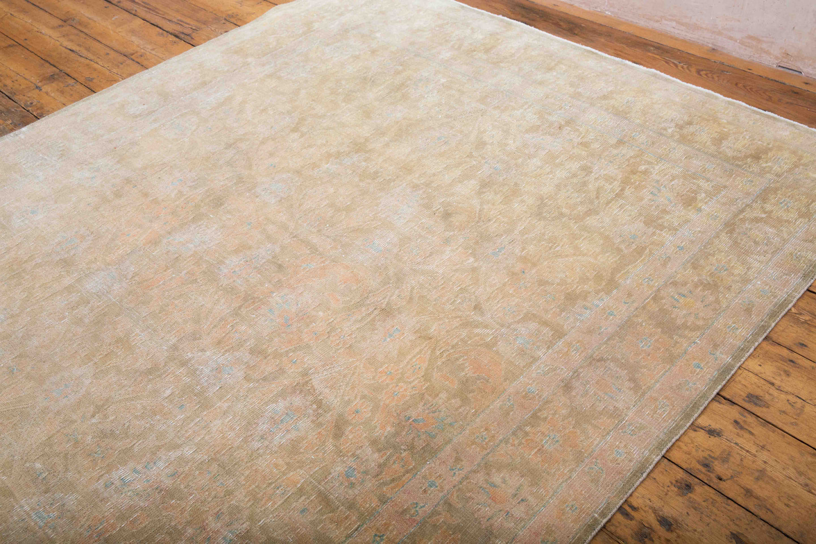 This is a vintage Persian Tabriz rug that has been over-dyed to gently fade its original colours, giving a more neutral palette. Persia has the most desirable rugs and carpets with stunning designs such as this carpet. Now available at Ourika London.