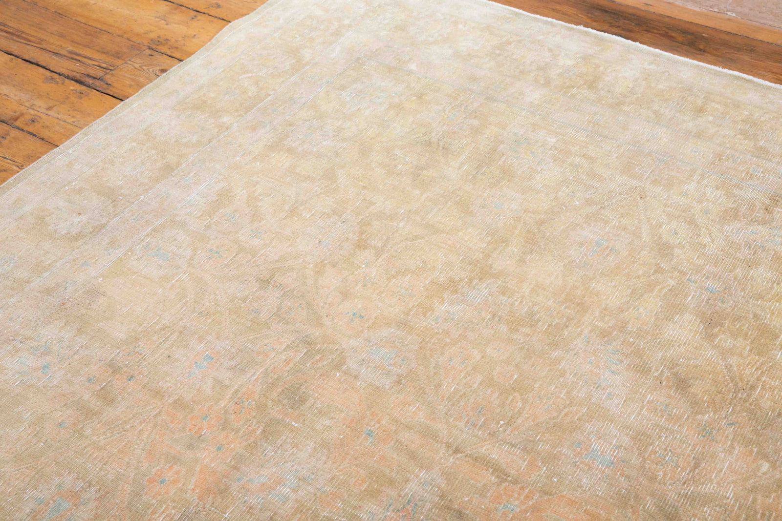 This is a vintage Persian Tabriz rug that has been over-dyed to gently fade its original colours, giving a more neutral palette. Persia has the most desirable rugs and carpets with stunning designs such as this carpet. Now available at Ourika London.