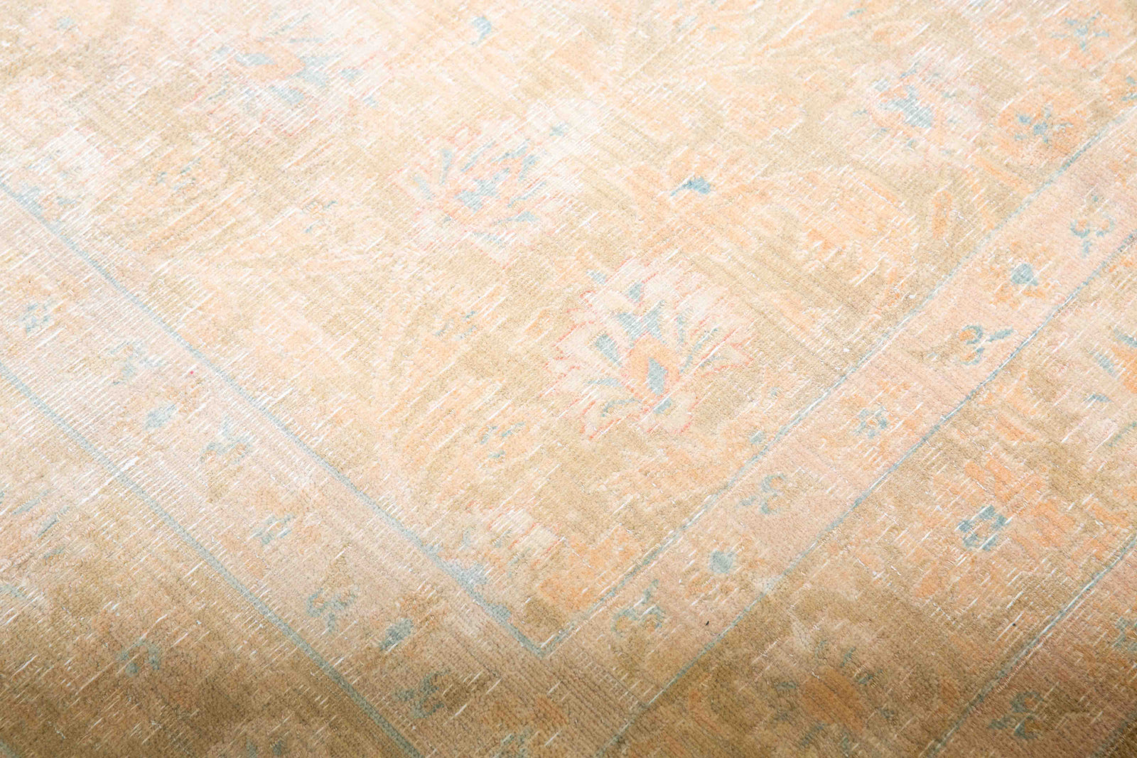 This is a vintage Persian Tabriz rug that has been over-dyed to gently fade its original colours, giving a more neutral palette. Persia has the most desirable rugs and carpets with stunning designs such as this carpet. Now available at Ourika London.