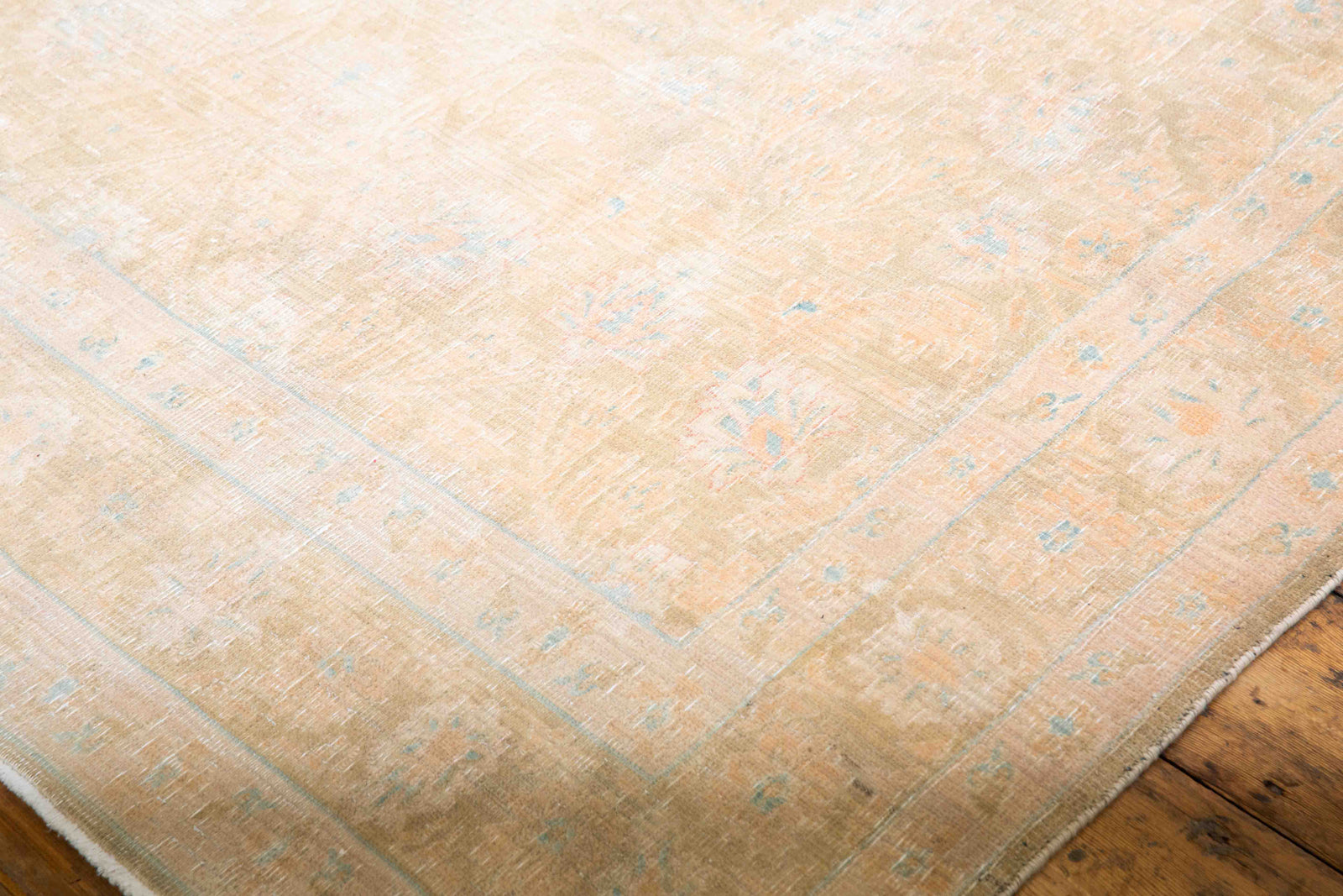 This is a vintage Persian Tabriz rug that has been over-dyed to gently fade its original colours, giving a more neutral palette. Persia has the most desirable rugs and carpets with stunning designs such as this carpet. Now available at Ourika London.