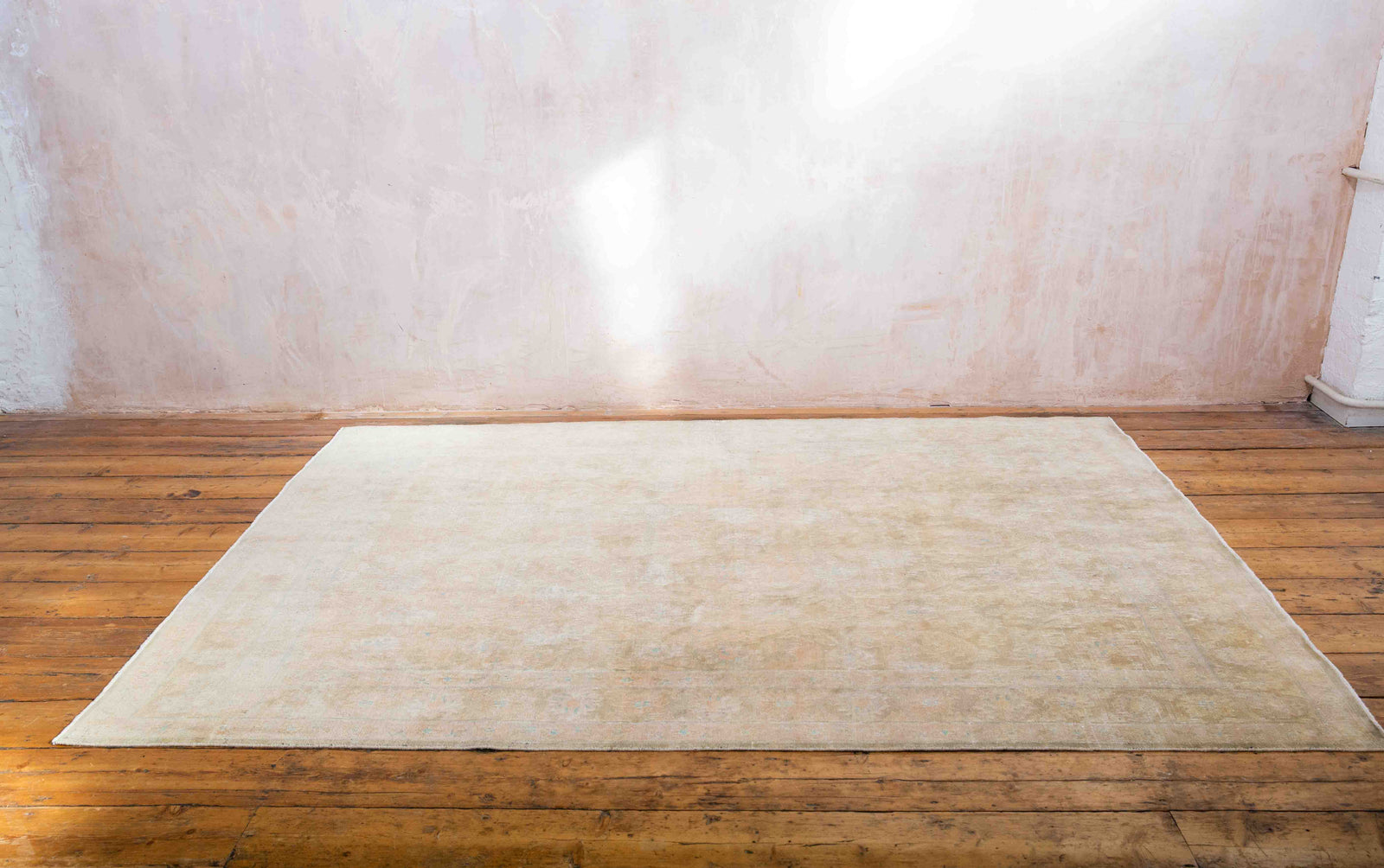 This is a vintage Persian Mahal rug that has been over-dyed to gently fade its original colours, giving a more neutral palette. Persia has the most desirable rugs and carpets with stunning designs such as this carpet. Now available at Ourika London.