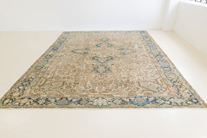 This is a vintage Persian Heriz rug that has been over-dyed to gently fade its original colours, giving a more neutral palette. Persia has the most desirable rugs and carpets with stunning designs such as this carpet. Now available at Ourika London.