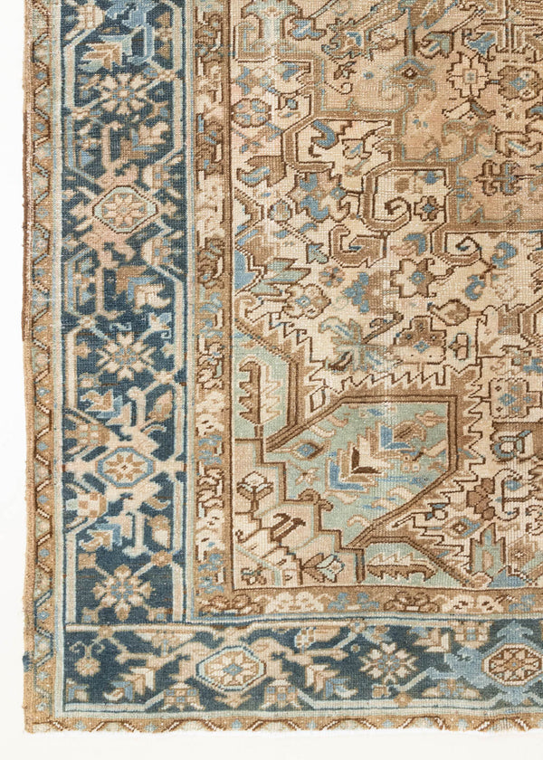 This is a vintage Persian Heriz rug that has been over-dyed to gently fade its original colours, giving a more neutral palette. Persia has the most desirable rugs and carpets with stunning designs such as this carpet. Now available at Ourika London.