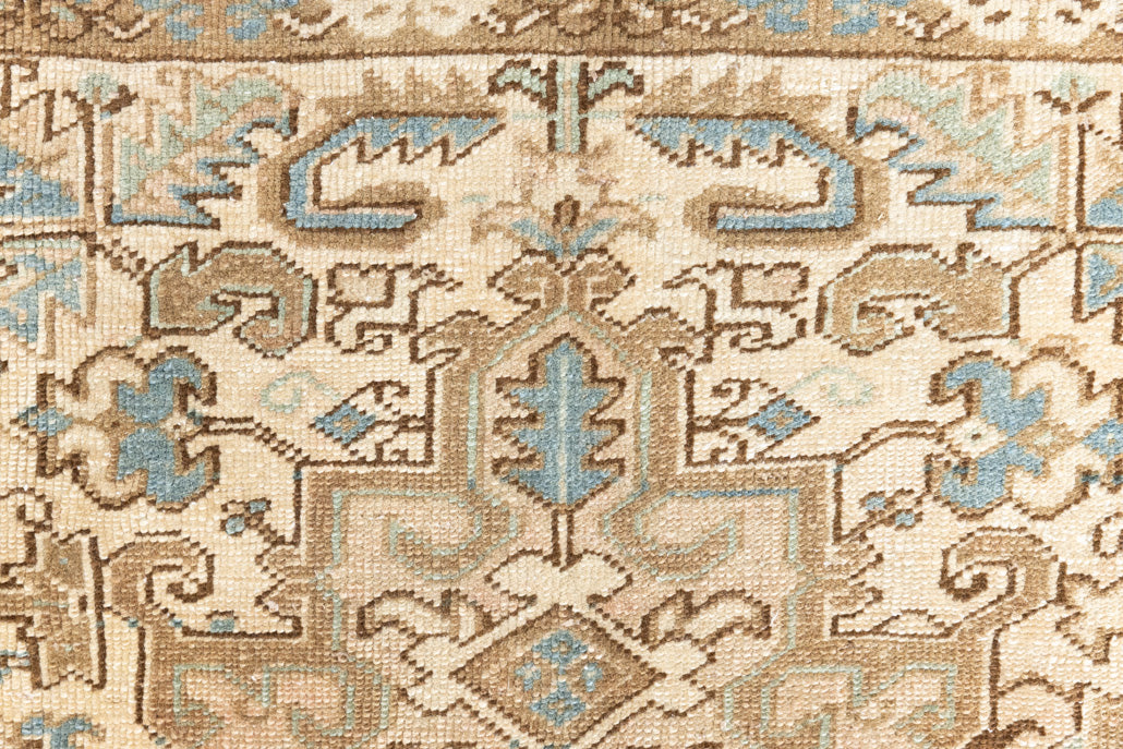 This is a vintage Persian Heriz rug that has been over-dyed to gently fade its original colours, giving a more neutral palette. Persia has the most desirable rugs and carpets with stunning designs such as this carpet. Now available at Ourika London.