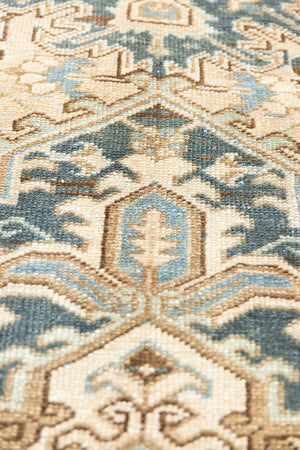 This is a vintage Persian Heriz rug that has been over-dyed to gently fade its original colours, giving a more neutral palette. Persia has the most desirable rugs and carpets with stunning designs such as this carpet. Now available at Ourika London.