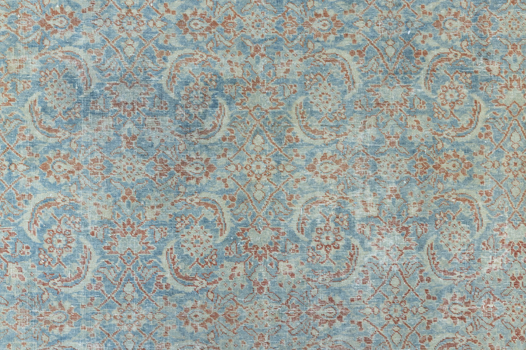 This is a handmade antique Farahan rug, woven in Persia. The Farahan region is known for producing some of the most ornate Persian carpets, often known for their mesmerising and intricate repeating patterns.