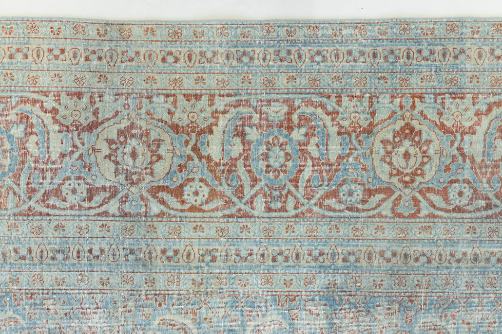 This is a handmade antique Farahan rug, woven in Persia. The Farahan region is known for producing some of the most ornate Persian carpets, often known for their mesmerising and intricate repeating patterns.
