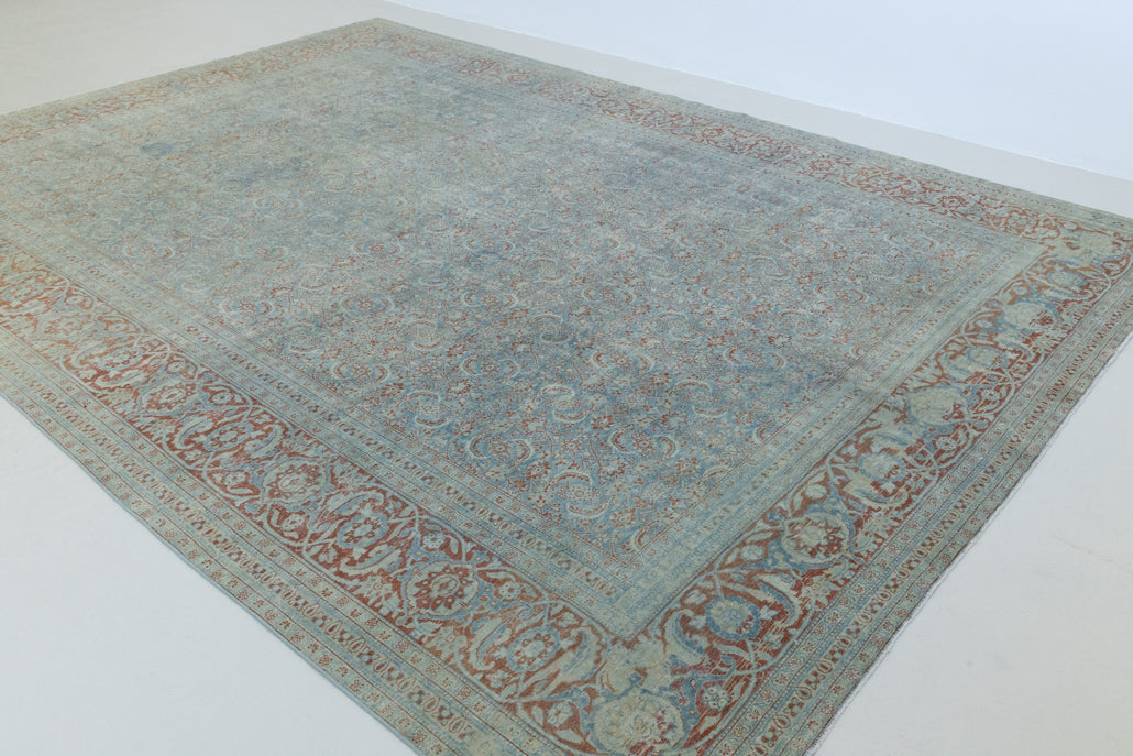 This is a handmade antique Farahan rug, woven in Persia. The Farahan region is known for producing some of the most ornate Persian carpets, often known for their mesmerising and intricate repeating patterns.