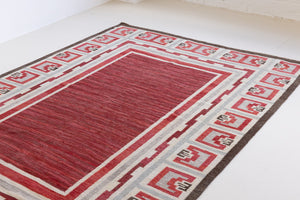 A rare vintage Swedish flatweave rug with a geometric Greek revival pattern in red, gray, and beige colours, featuring a wide border. By designer Aina Kånge