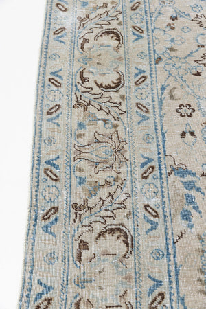 This pair of vintage handknotted Persian rugs are from the Tabriz region. Perisa is one of the oldest rug weaving centres in the world featuring floral patterns and muted colours as seen on these carpets.