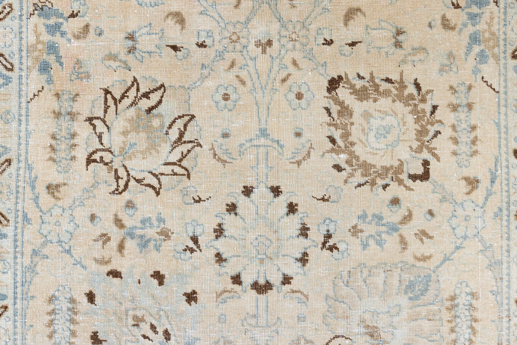 This pair of vintage handknotted Persian rugs are from the Tabriz region. Perisa is one of the oldest rug weaving centres in the world featuring floral patterns and muted colours as seen on these carpets.