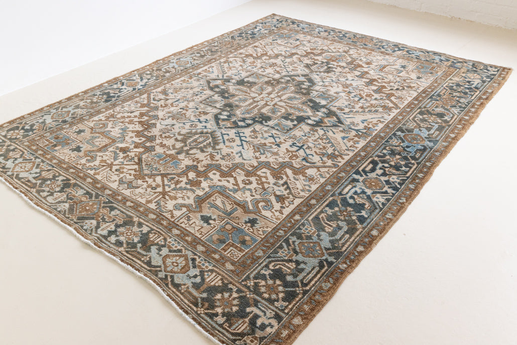 Claudia is a vintage Persian Heriz rug that has been over-dyed to gently fade its original colours, giving a more neutral palette. Persia has the most desirable rugs and carpets with stunning designs such as this carpet. Now available at Ourika London.