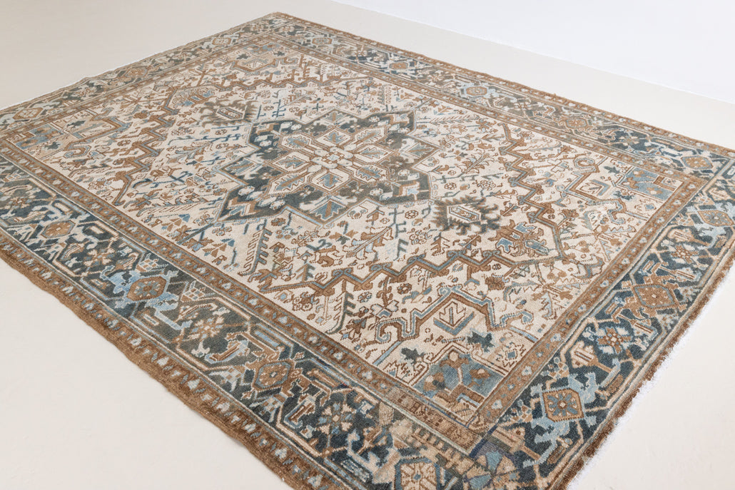 Claudia is a vintage Persian Heriz rug that has been over-dyed to gently fade its original colours, giving a more neutral palette. Persia has the most desirable rugs and carpets with stunning designs such as this carpet. Now available at Ourika London.