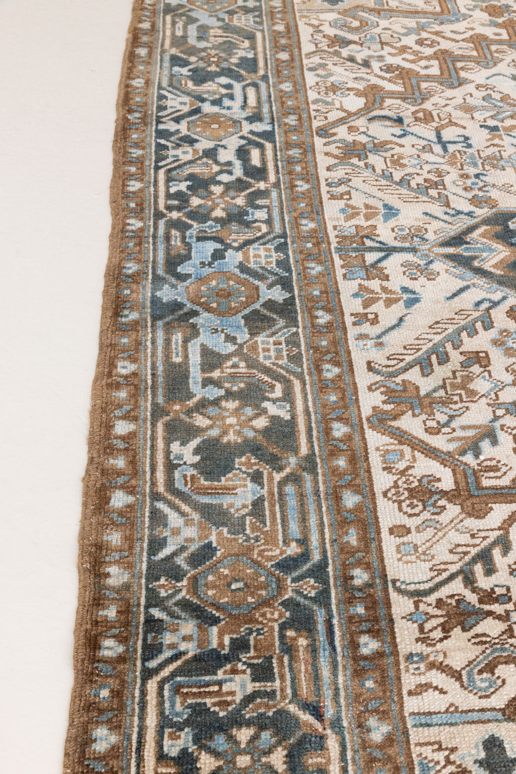 Claudia is a vintage Persian Heriz rug that has been over-dyed to gently fade its original colours, giving a more neutral palette. Persia has the most desirable rugs and carpets with stunning designs such as this carpet. Now available at Ourika London.