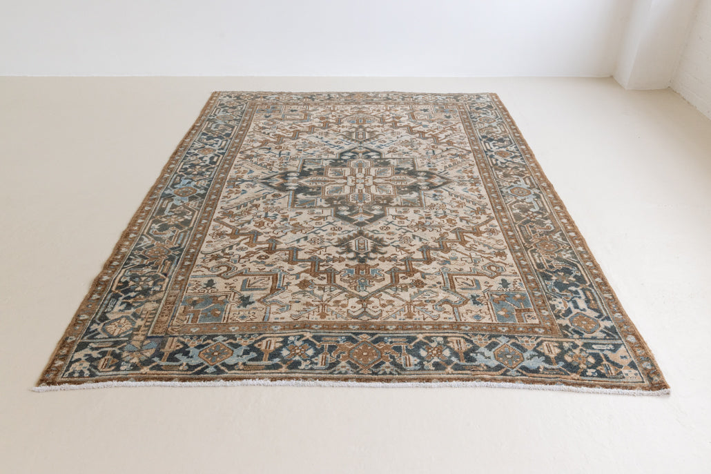 Claudia is a vintage Persian Heriz rug that has been over-dyed to gently fade its original colours, giving a more neutral palette. Persia has the most desirable rugs and carpets with stunning designs such as this carpet. Now available at Ourika London.