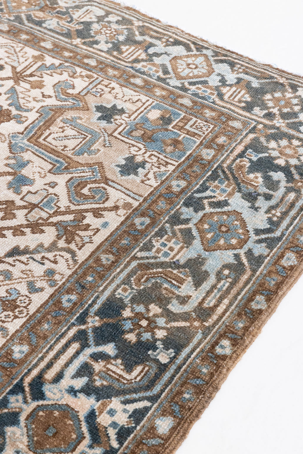 Claudia is a vintage Persian Heriz rug that has been over-dyed to gently fade its original colours, giving a more neutral palette. Persia has the most desirable rugs and carpets with stunning designs such as this carpet. Now available at Ourika London.