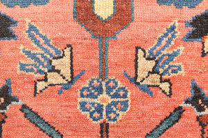 Lilian rugs were handwoven in a small village in Western Iran and often feature floral and geometric patterns as seen here. This small vintage carpet features a soft pink and blue colour palette and an intricate design inspired by nature.