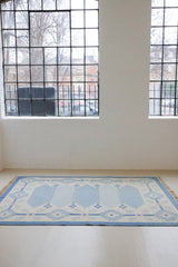 This beautiful vintage Swedish flatweave rug features a stunning blue colour palette and an elegant geometric design.