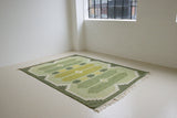 Alf is a vintage rug handwoven in Sweden for Svensk He Mslöjd which is a 1899 founded non-profit association that focused on Swedish textiles. This beautiful flatweave features a stunning green colour palette and an elegant geometric design.