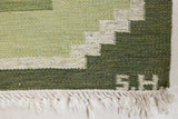 Alf is a vintage rug handwoven in Sweden for Svensk He Mslöjd which is a 1899 founded non-profit association that focused on Swedish textiles. This beautiful flatweave features a stunning green colour palette and an elegant geometric design.