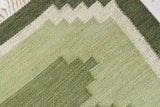 Alf is a vintage rug handwoven in Sweden for Svensk He Mslöjd which is a 1899 founded non-profit association that focused on Swedish textiles. This beautiful flatweave features a stunning green colour palette and an elegant geometric design.