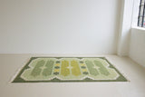 Alf is a vintage rug handwoven in Sweden for Svensk He Mslöjd which is a 1899 founded non-profit association that focused on Swedish textiles. This beautiful flatweave features a stunning green colour palette and an elegant geometric design.