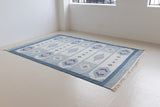 Mason is a vintage rug handwoven in Sweden, featuring a beautiful blue and pink colour palette and a rare large room size.