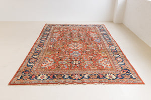 This a Vintage Persian Rug from Mahal in Persia. This hand woven Carpet features a lovely red ground with an all over design.