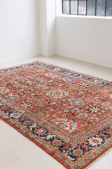  This a Vintage Persian Rug from Mahal in Persia. This hand woven Carpet features a lovely red ground with an all over design.