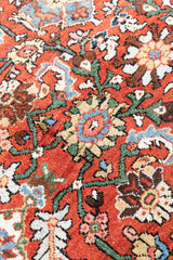 This a Vintage Persian Rug from Mahal in Persia. This hand woven Carpet features a lovely red ground with an all over design.