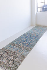 Isabelle is a Persian Malayer runner with a beautiful palette of blues and terracotta softened by a wonderful patina. The antique runner also features the iconic Boteh motif symbolising growth and resilience. 