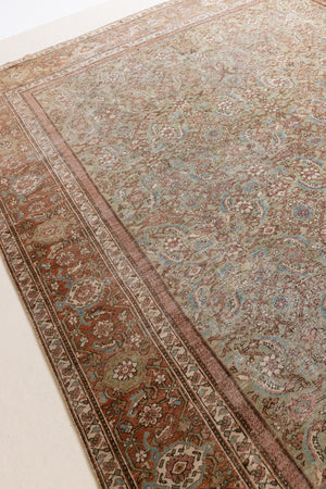 Mahal rugs are some of the most desirable Persian village rugs. This Carpet features an extremely rare pistachio green field and a highly unique floral Herati design 