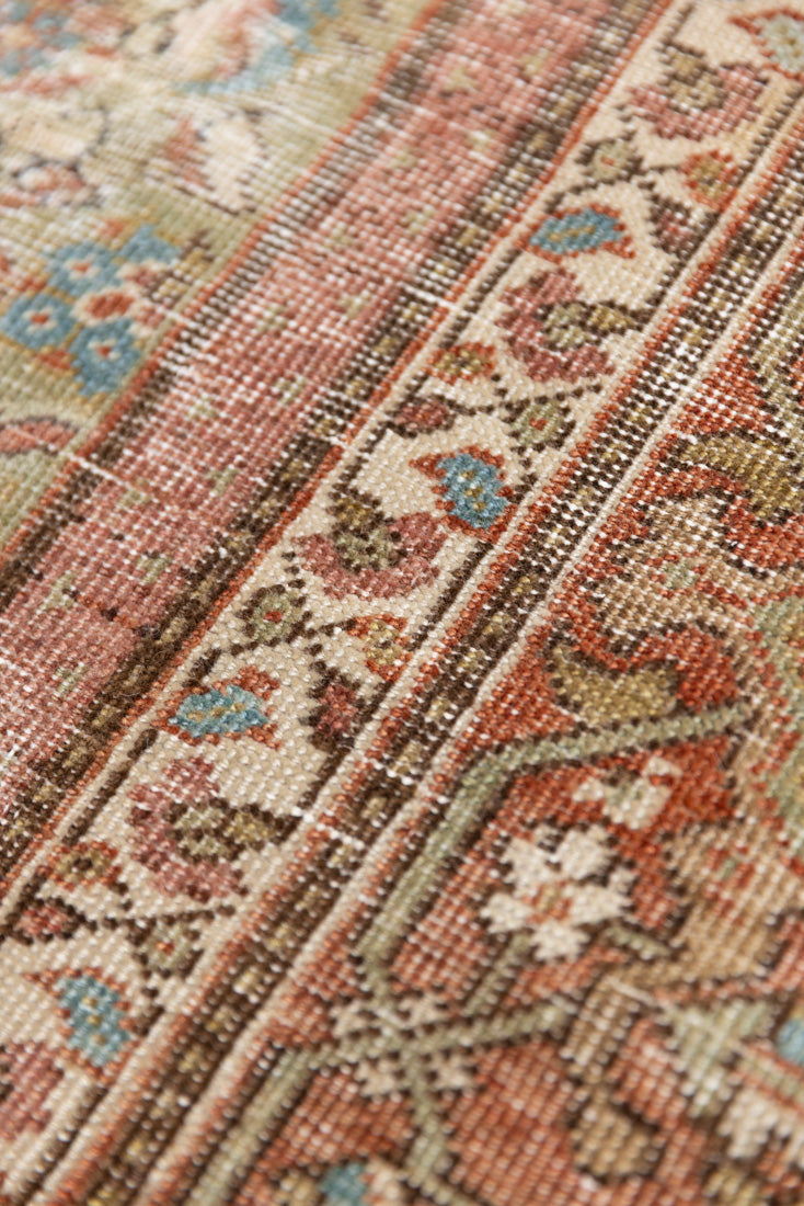 Mahal rugs are some of the most desirable Persian village rugs. This Carpet features an extremely rare pistachio green field and a highly unique floral Herati design 