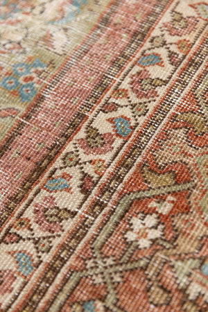 Mahal rugs are some of the most desirable Persian village rugs. This Carpet features an extremely rare pistachio green field and a highly unique floral Herati design 