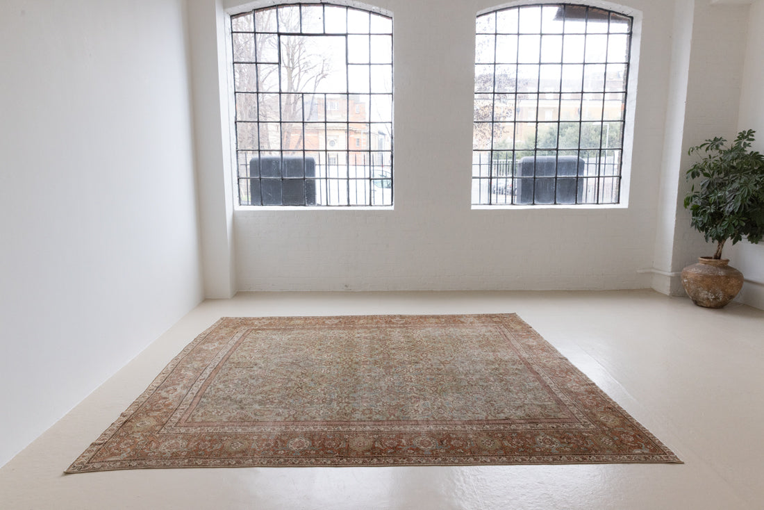 Mahal rugs are some of the most desirable Persian village rugs. This Carpet features an extremely rare pistachio green field and a highly unique floral Herati design 