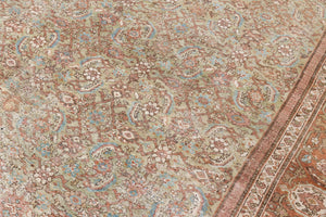 Mahal rugs are some of the most desirable Persian village rugs. This Carpet features an extremely rare pistachio green field and a highly unique floral Herati design 