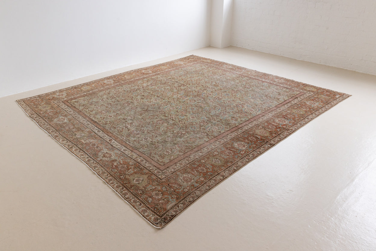 Mahal rugs are some of the most desirable Persian village rugs. This Carpet features an extremely rare pistachio green field and a highly unique floral Herati design 