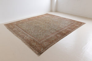 Mahal rugs are some of the most desirable Persian village rugs. This Carpet features an extremely rare pistachio green field and a highly unique floral Herati design 